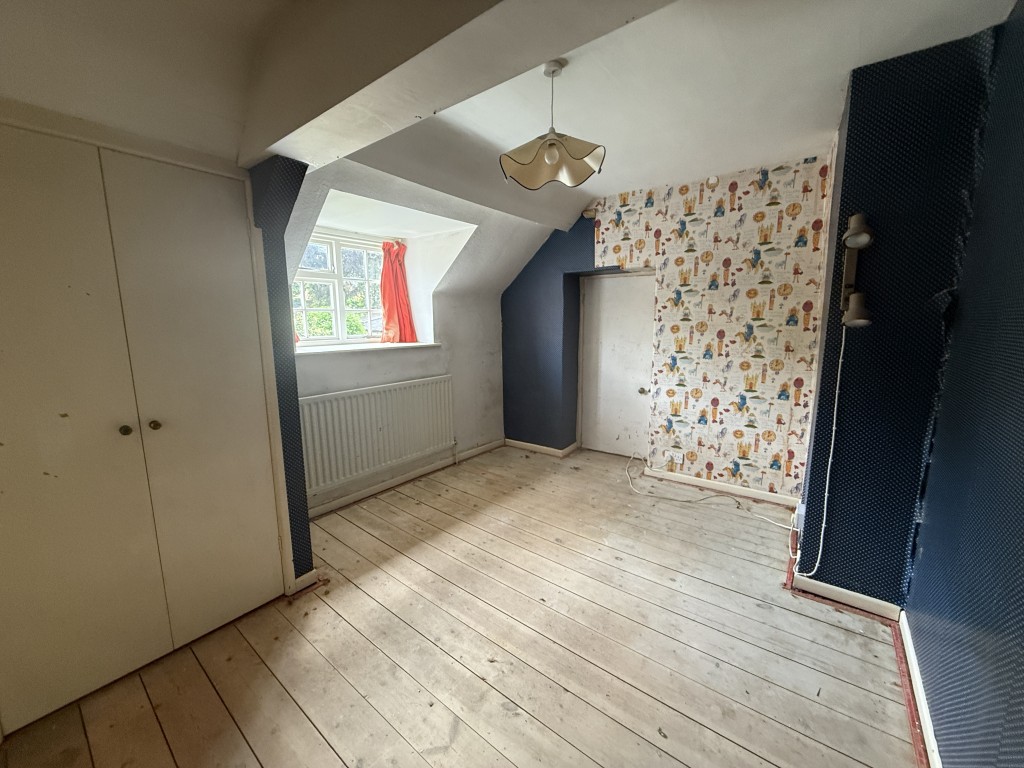 Lot: 99 - CHARACTER SEMI-DETACHED COTTAGE FOR UPDATING WITH LARGE GARDENS - Bedroom two with three storage cupboards